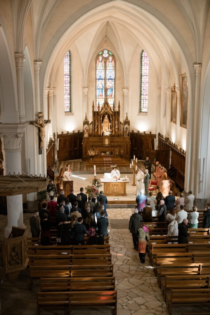 Overhead view of a religious wedding ceremony in a Gothic church near Lake Annecy