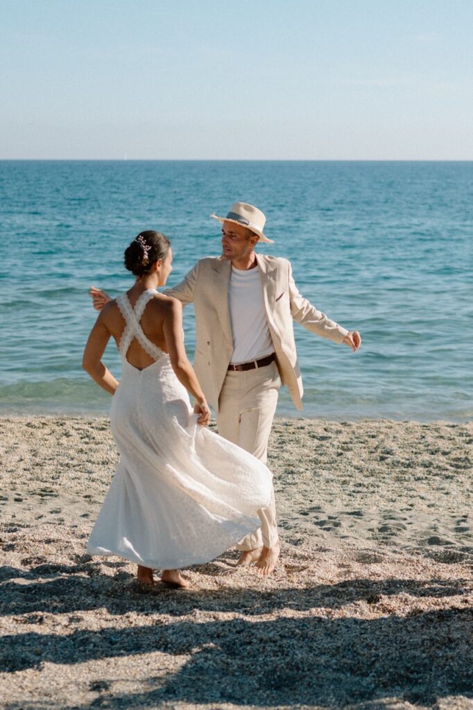 Bride and groom dancing on the beach, wedding photographer Italian Riviera