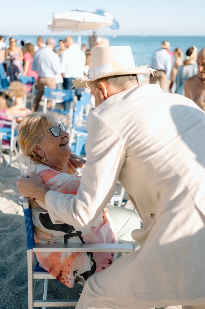 Groom with family after wedding ceremony, destination wedding Italy